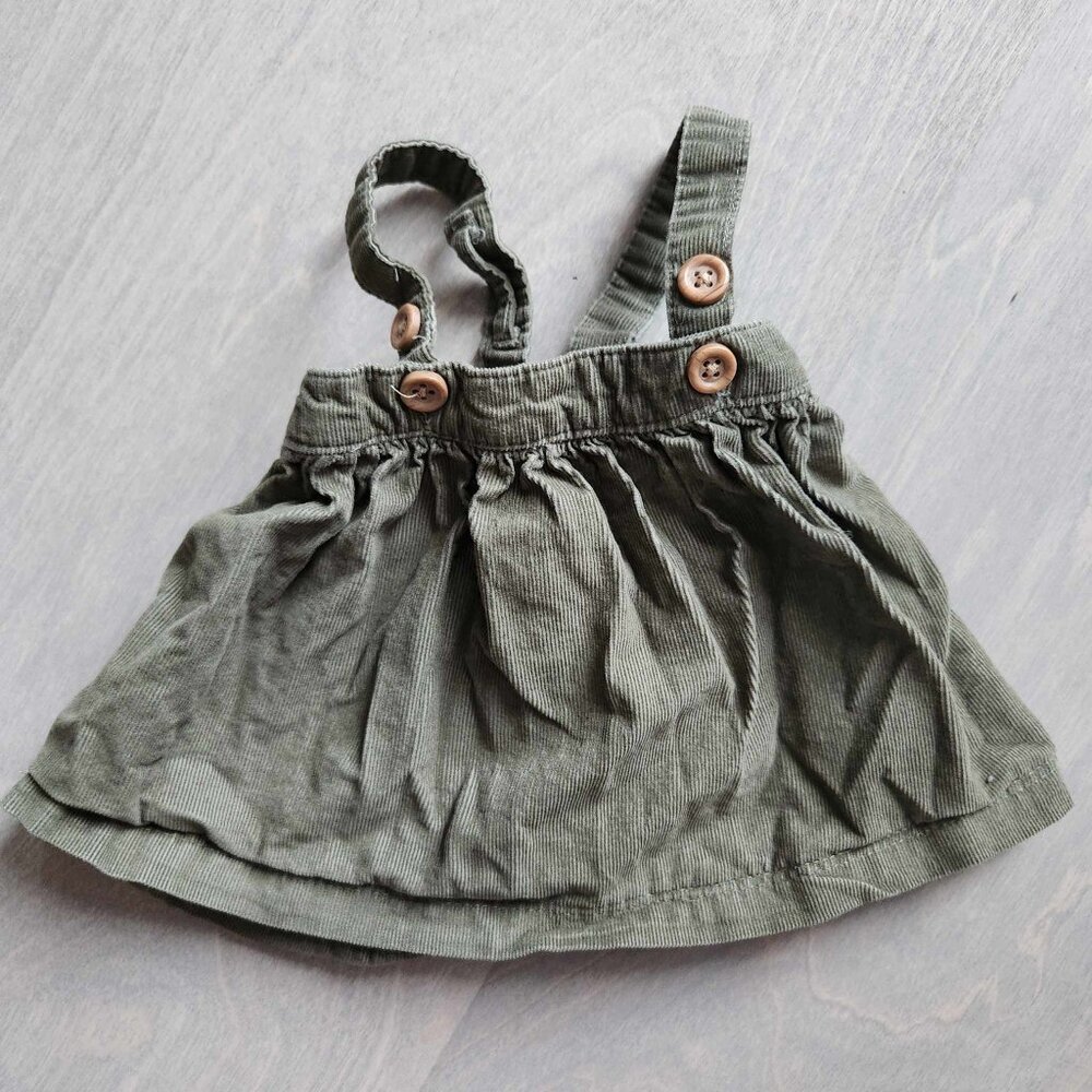 Organic cotton little planet NB green corduroy dress suspender style
